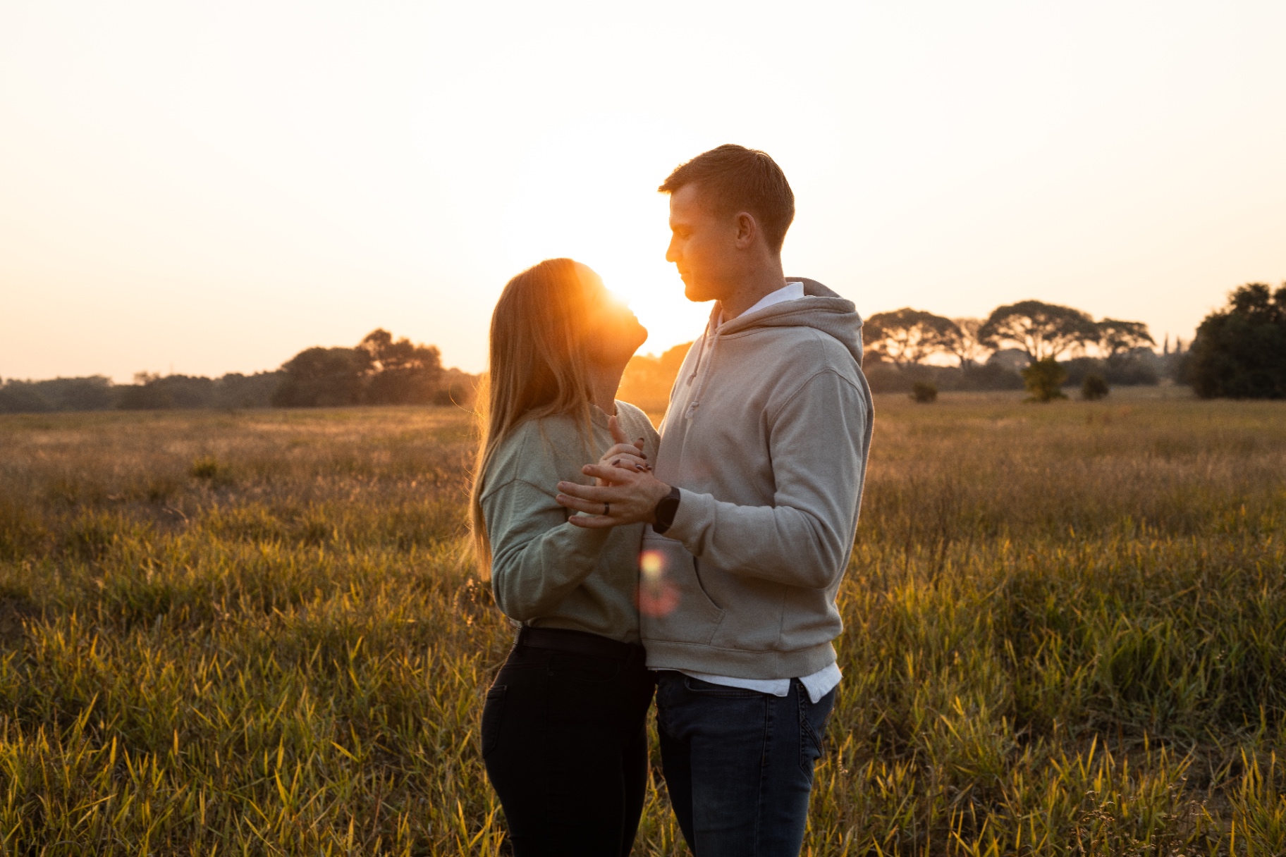 Intimate lifestyle portrait in warm window light
